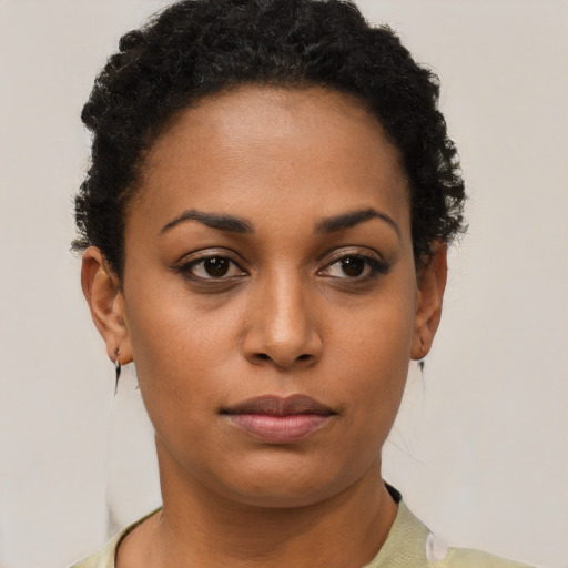 Neutral black young-adult female with short  brown hair and brown eyes