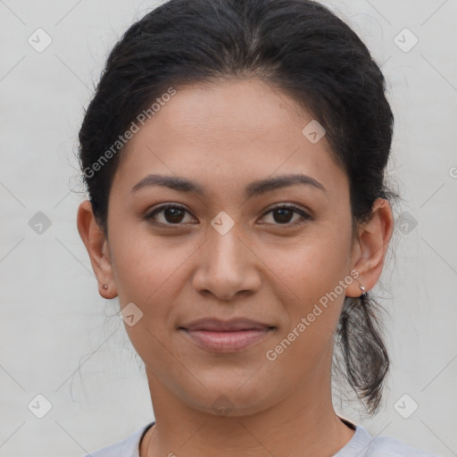 Joyful latino young-adult female with short  brown hair and brown eyes