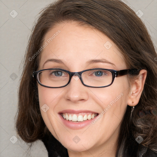 Joyful white adult female with long  brown hair and grey eyes