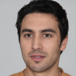Neutral white young-adult male with short  black hair and brown eyes