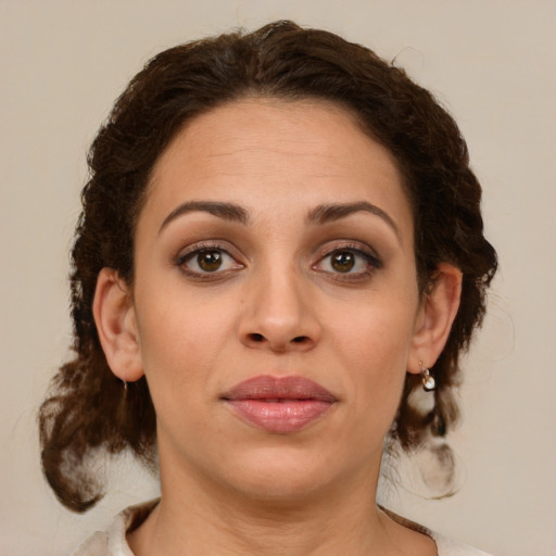 Joyful white young-adult female with medium  brown hair and green eyes