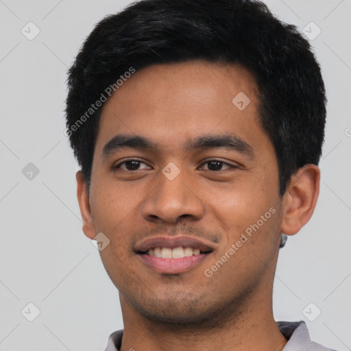 Joyful asian young-adult male with short  black hair and brown eyes