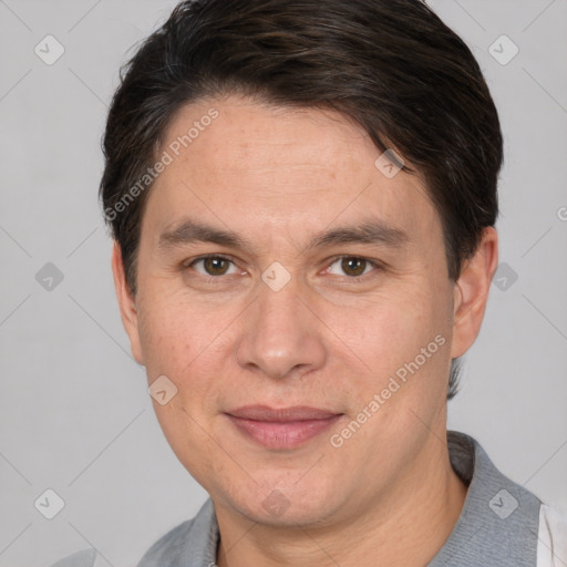 Joyful white adult male with short  brown hair and brown eyes