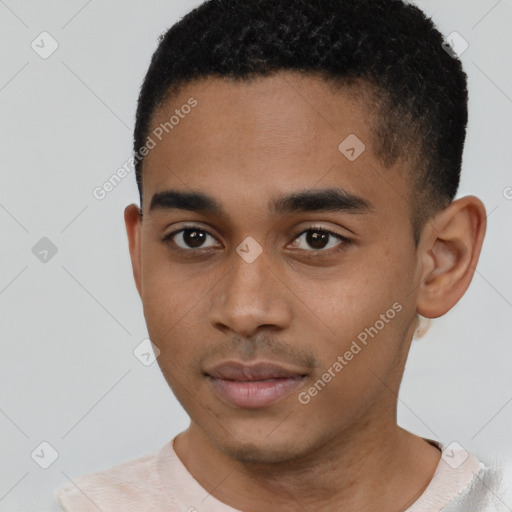 Joyful black young-adult male with short  brown hair and brown eyes