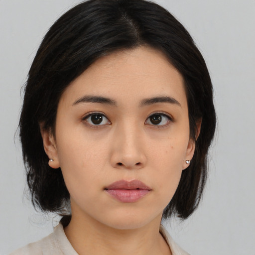 Neutral asian young-adult female with medium  black hair and brown eyes