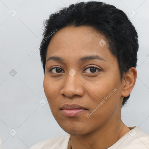 Joyful latino young-adult female with short  black hair and brown eyes