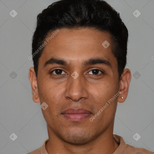 Joyful latino young-adult male with short  black hair and brown eyes