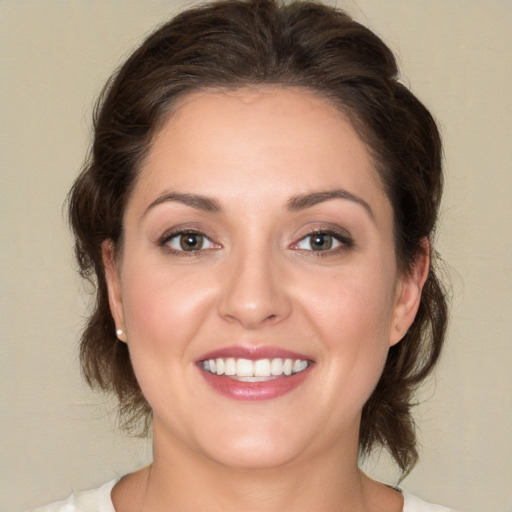 Joyful white young-adult female with medium  brown hair and brown eyes