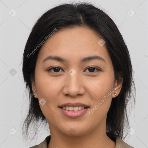 Joyful asian young-adult female with medium  brown hair and brown eyes