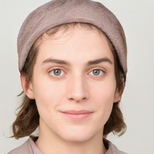 Joyful white young-adult female with medium  brown hair and blue eyes