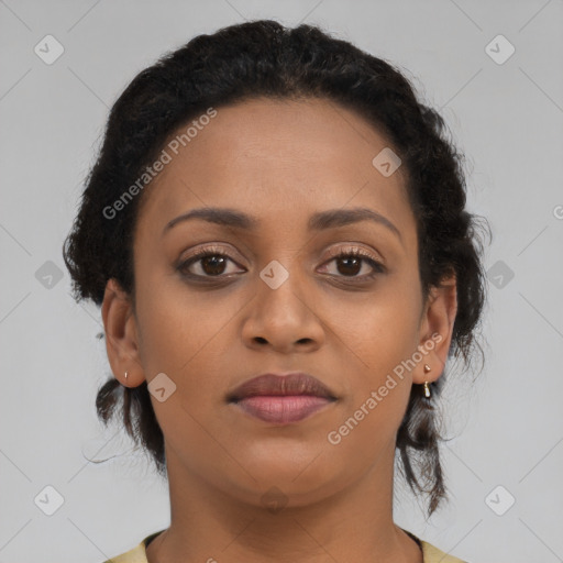 Joyful black young-adult female with medium  brown hair and brown eyes
