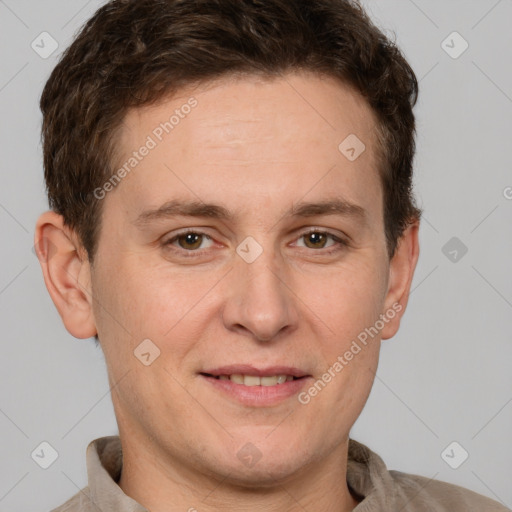 Joyful white adult male with short  brown hair and grey eyes