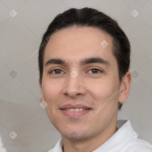 Joyful white young-adult male with short  black hair and brown eyes