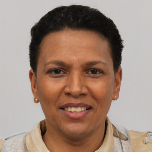 Joyful latino adult female with short  black hair and brown eyes