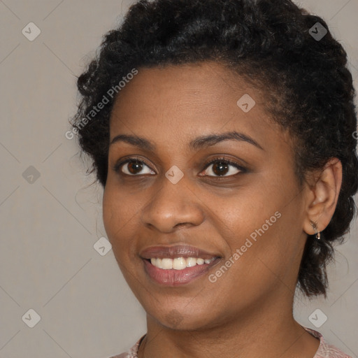 Joyful black young-adult female with medium  black hair and brown eyes