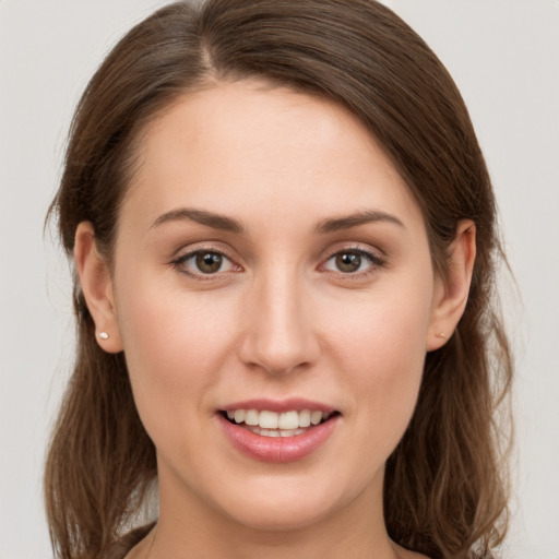 Joyful white young-adult female with long  brown hair and grey eyes