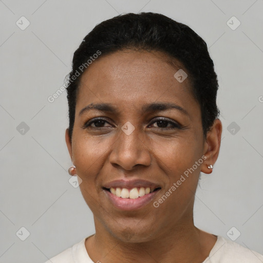 Joyful latino young-adult female with short  black hair and brown eyes