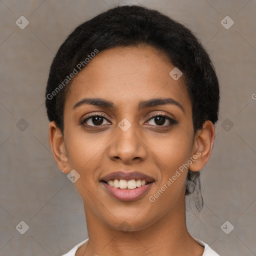 Joyful latino young-adult female with short  black hair and brown eyes