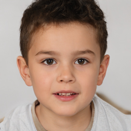 Joyful white child male with short  brown hair and brown eyes