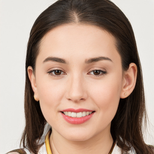 Joyful white young-adult female with medium  brown hair and brown eyes