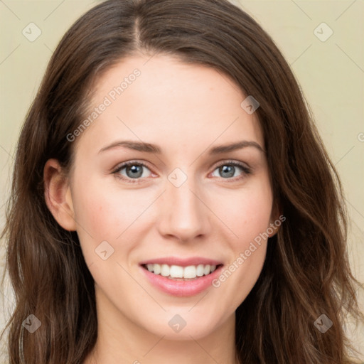 Joyful white young-adult female with long  brown hair and green eyes