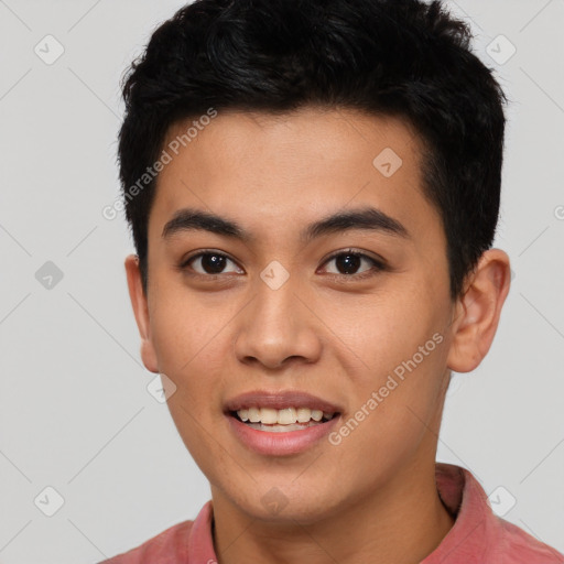 Joyful asian young-adult male with short  black hair and brown eyes