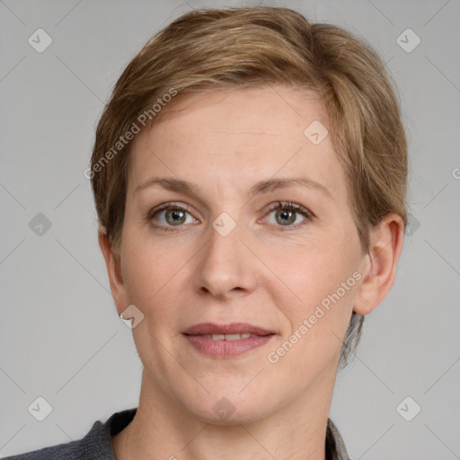 Joyful white adult female with short  brown hair and grey eyes