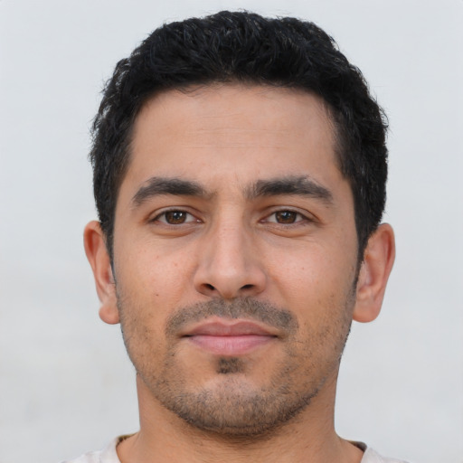 Neutral latino young-adult male with short  black hair and brown eyes