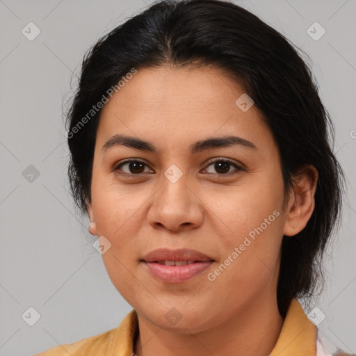 Joyful latino young-adult female with medium  brown hair and brown eyes