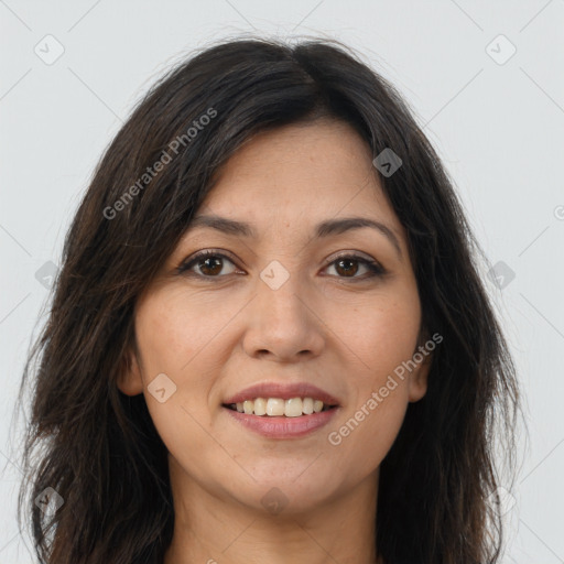 Joyful white adult female with long  brown hair and brown eyes