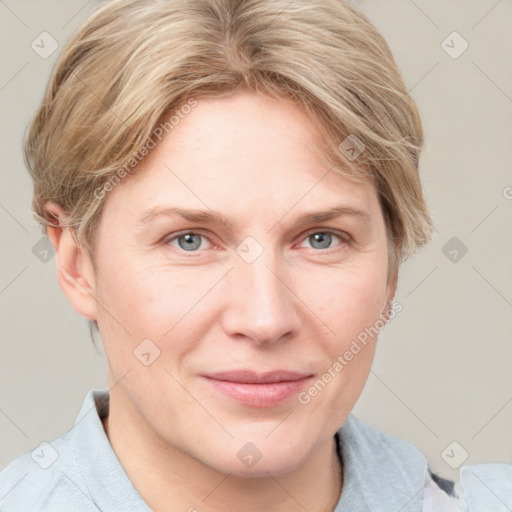 Joyful white adult female with medium  brown hair and blue eyes