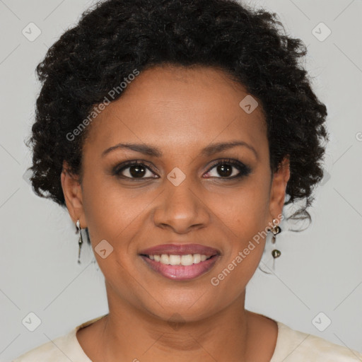 Joyful black young-adult female with short  brown hair and brown eyes