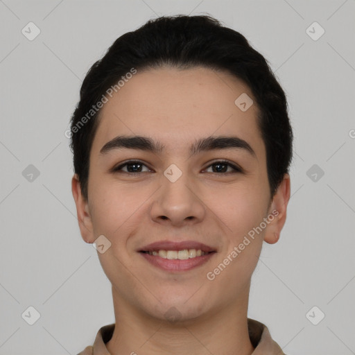 Joyful white young-adult male with short  black hair and brown eyes