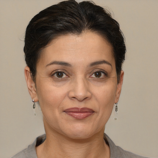 Joyful white adult female with short  brown hair and brown eyes