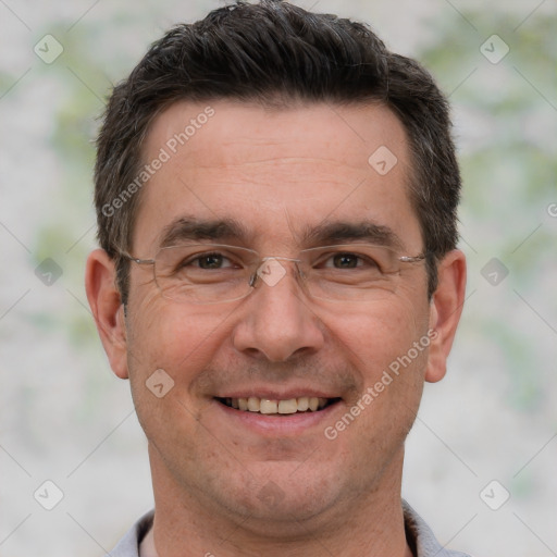 Joyful white adult male with short  brown hair and brown eyes