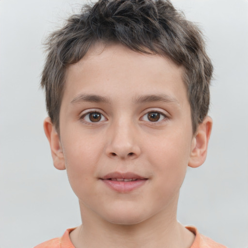 Joyful white child male with short  brown hair and brown eyes