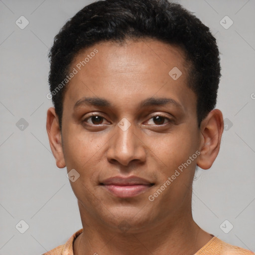 Joyful latino young-adult male with short  black hair and brown eyes