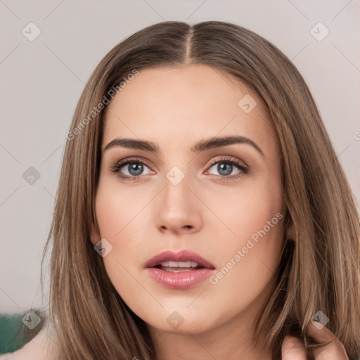 Neutral white young-adult female with long  brown hair and brown eyes