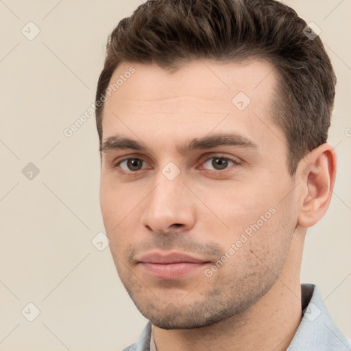 Neutral white young-adult male with short  brown hair and brown eyes