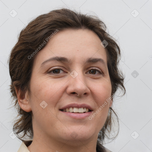 Joyful white adult female with medium  brown hair and grey eyes