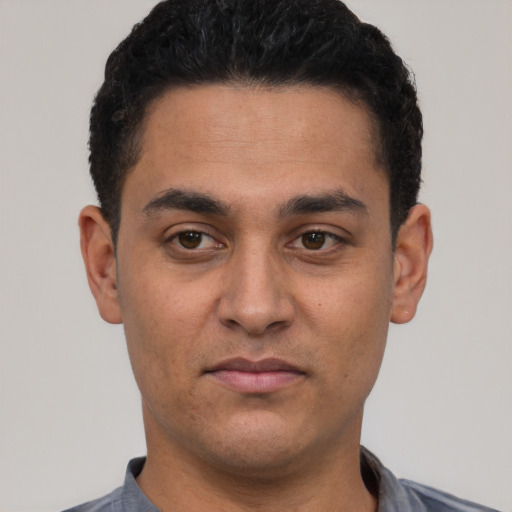 Neutral white young-adult male with short  black hair and brown eyes