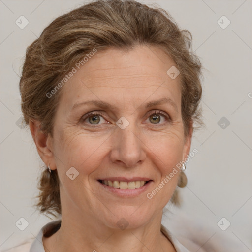 Joyful white adult female with medium  brown hair and blue eyes