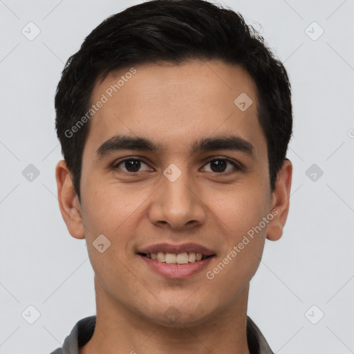 Joyful latino young-adult male with short  brown hair and brown eyes