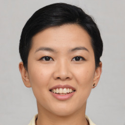 Joyful asian young-adult female with short  black hair and brown eyes