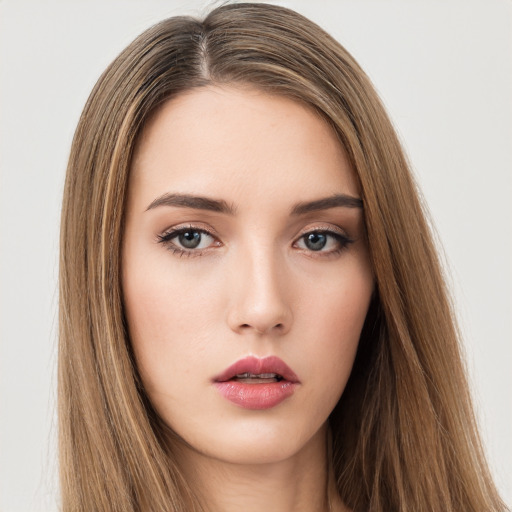 Neutral white young-adult female with long  brown hair and brown eyes