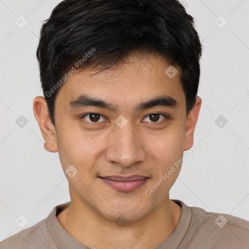 Joyful latino young-adult male with short  black hair and brown eyes