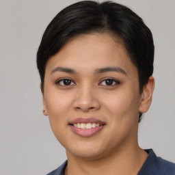 Joyful asian young-adult female with short  brown hair and brown eyes