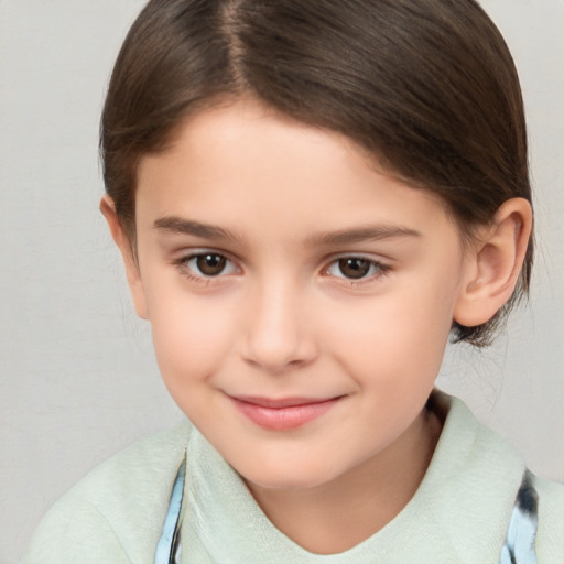 Joyful white child female with medium  brown hair and brown eyes