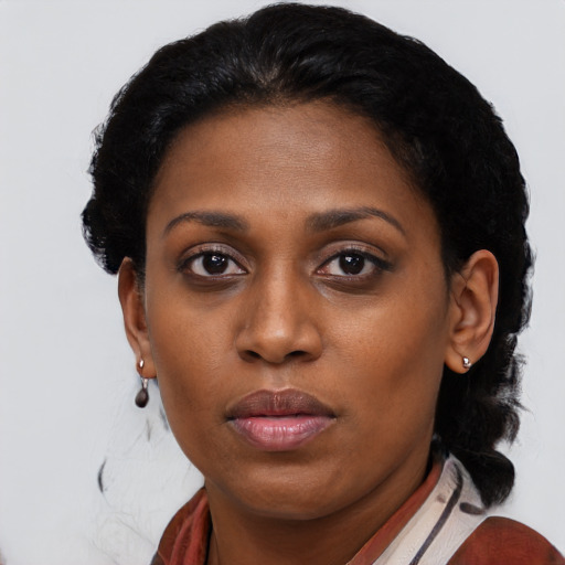 Neutral black young-adult female with medium  black hair and brown eyes