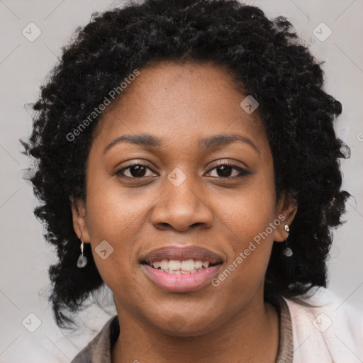 Joyful black young-adult female with long  brown hair and brown eyes